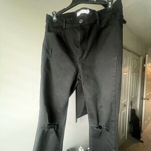 women’s black high rise jeans with distressed legs , size 11